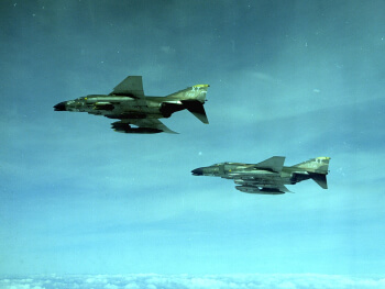 Two F-4C Phantom IIs over South Vietnam in December 1968.