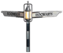 A signpost with a sign pointing to Hogsmeade.
